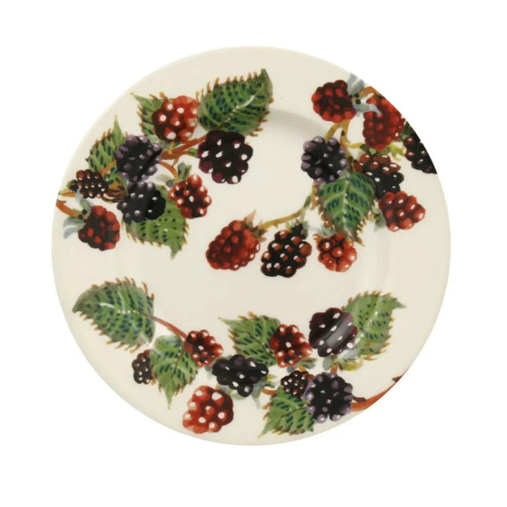 Decorative plate with blackberries and leaves on a white background