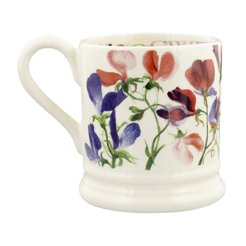 Ceramic mug with floral design on a white background