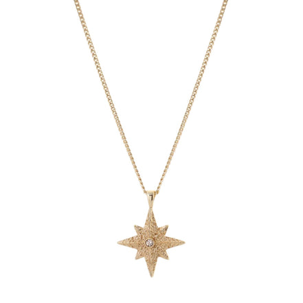 Gold star-shaped pendant necklace on a white background