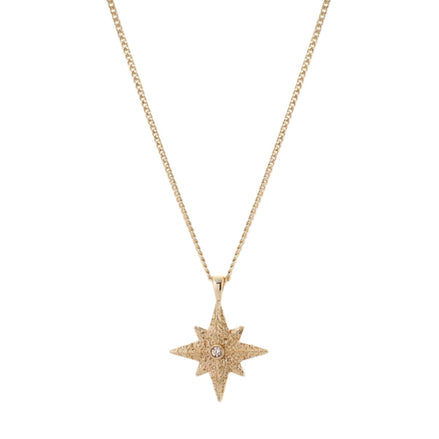 Gold star-shaped pendant necklace on a white background