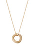 Gold necklace with a textured circular pendant on a white background