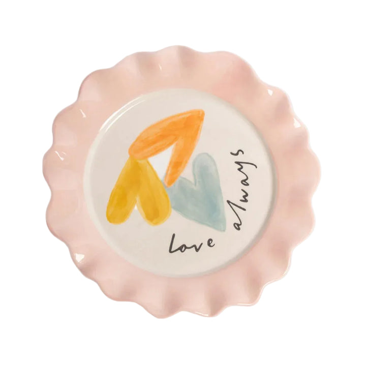 Decorative plate with wavy edge, colorful hearts, and &