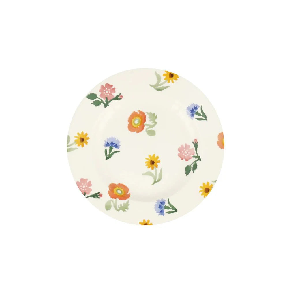Round ceramic plate with floral pattern on a white background