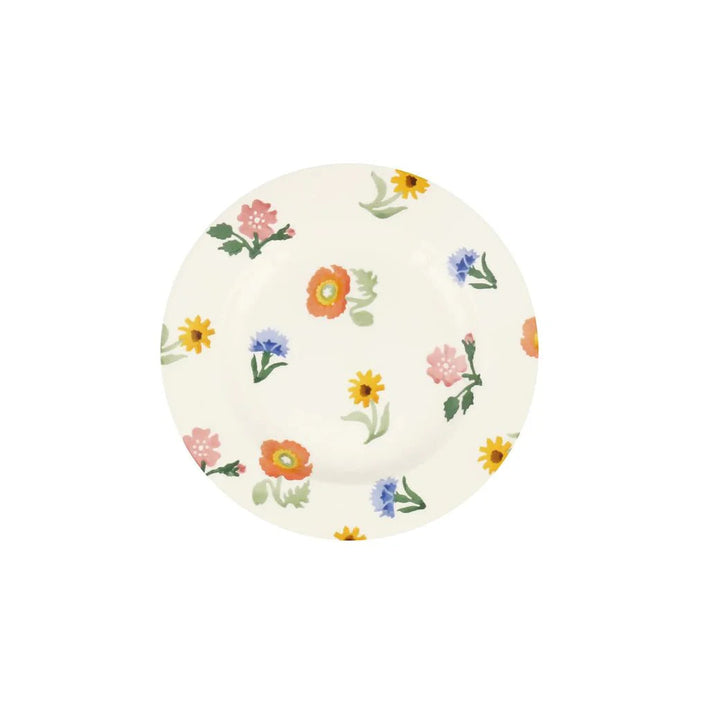Round ceramic plate with floral pattern on a white background