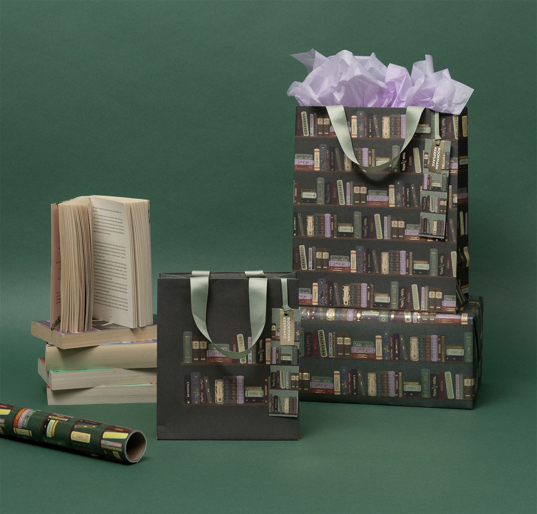 Set of gift bags with book pattern on a green background