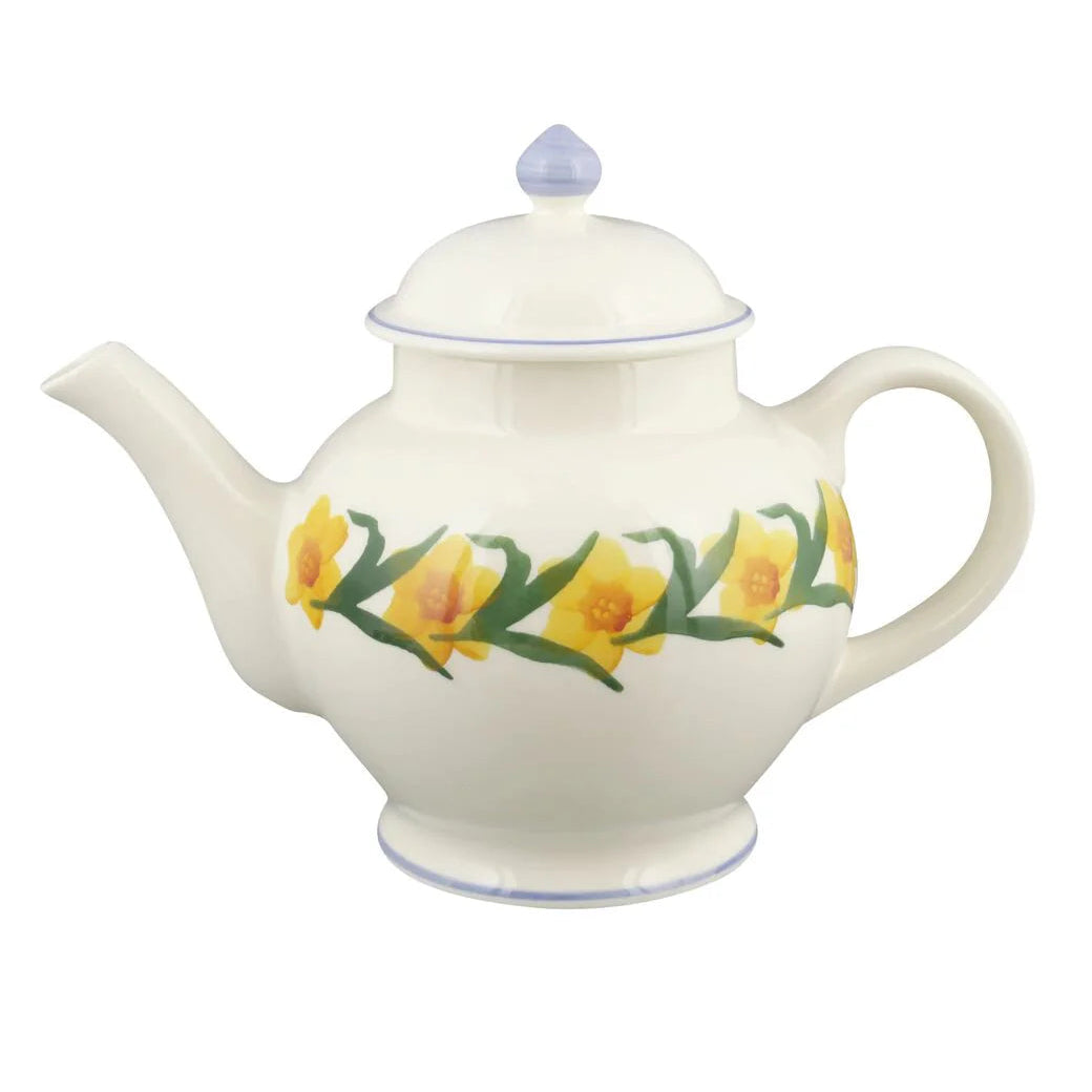 Ceramic teapot with floral design on a white background